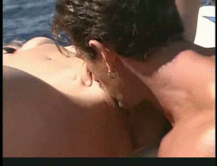 Busty blonde rides on boat