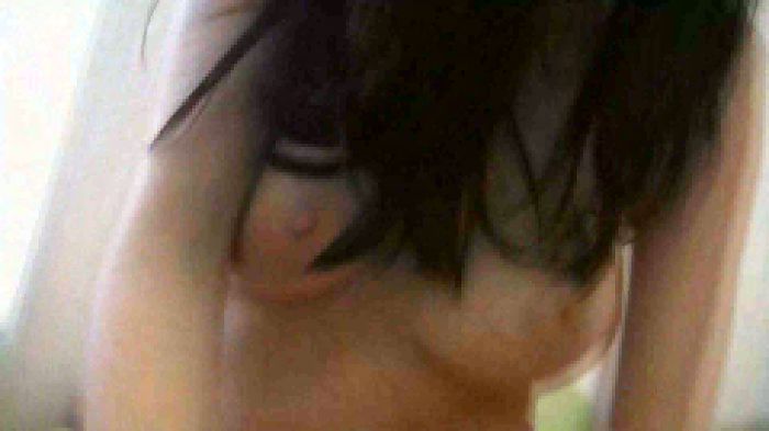 Young girl in panties with natural boobs